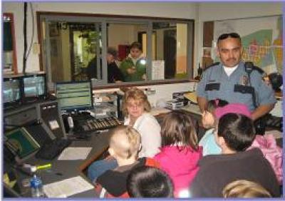 school students getting a tour of the police department