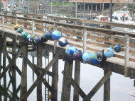 Floating object on the side of a dock